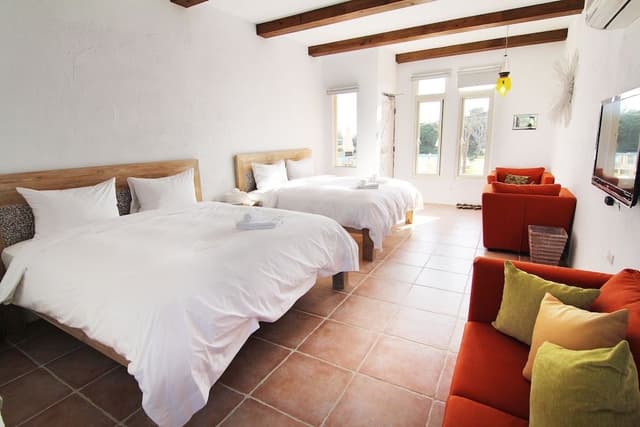 Deluxe Quadruple Room, 2 Queen Beds, Bathtub, Ocean View
