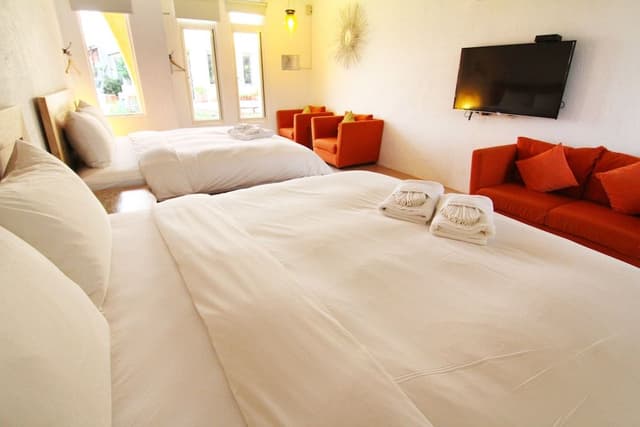 Deluxe Quadruple Room, 2 Queen Beds, Bathtub, Ocean View