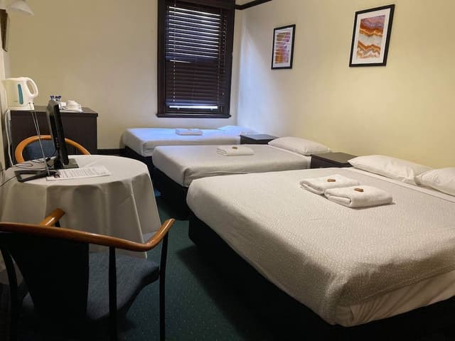 Quadruple Room (1 Queen and 2 Single) with Shared Bathroom