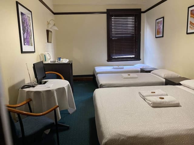 Quadruple Room (1 Queen and 2 Single) with Shared Bathroom