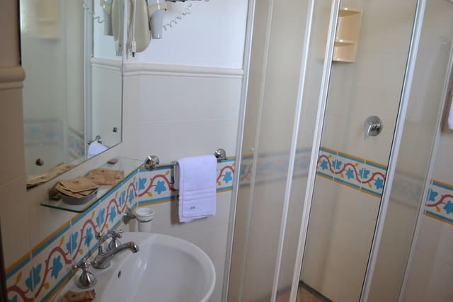Deluxe Triple Room, Multiple Beds, Ensuite, Partial Sea View