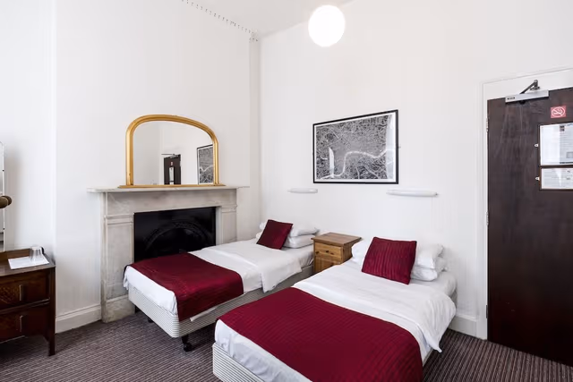 Twin room with shared bathroom