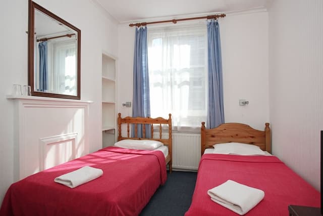 Twin room with shared bathroom