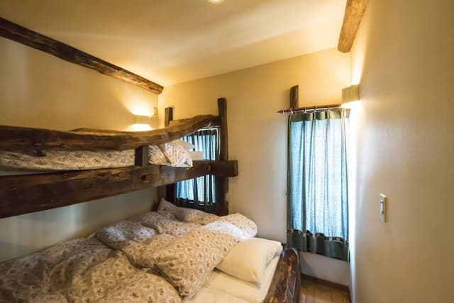 Woody Triple Log Bed with Shared Bathroom