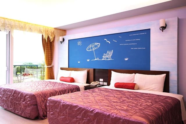Deluxe Quadruple Room, 2 Queen Beds, Balcony, Sea View