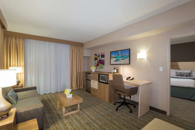 Suite-2 Double Beds, Non-Smoking, Executive Room, Separate Living Area, Balcony, Microwave And Refrigerator, High Speed Internet Access