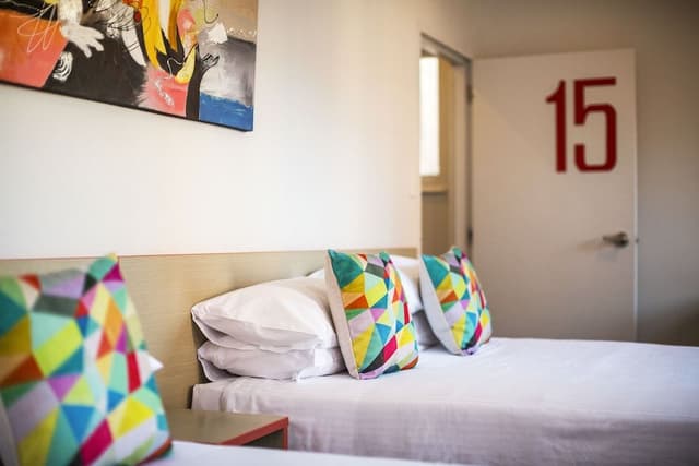 Economy Twin Queen with Shared Facilities