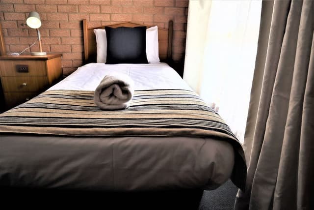 Family Room (4 People) - 1 Queen and 2 Single Beds