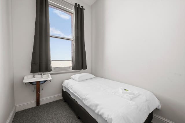 Basic Single Room, 1 Twin Bed, Shared Bathroom