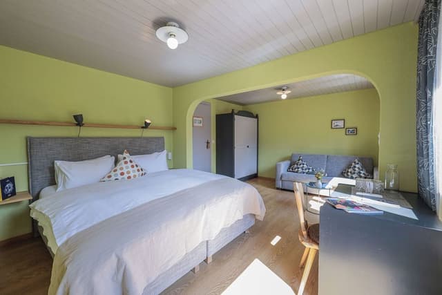 Double room with additional sofa bed