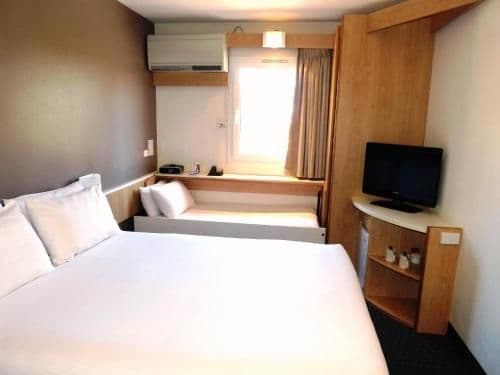 Standard Room with a Queen Bed and a Foldable Bed