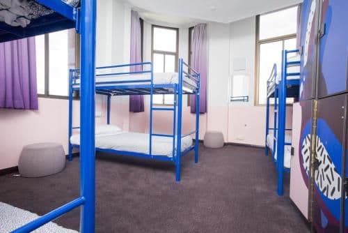 Bed in 6-Bed Male Dormitory Room with Shared Bathroom
