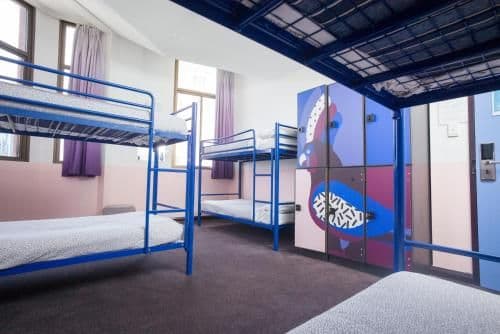 Bed in 6-Bed Male Dormitory Room with Shared Bathroom