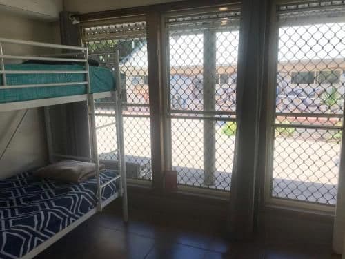 Bed in 4-Bed Dormitory Room with Shared Bathroom