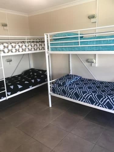 Bed in 4-Bed Dormitory Room with Shared Bathroom