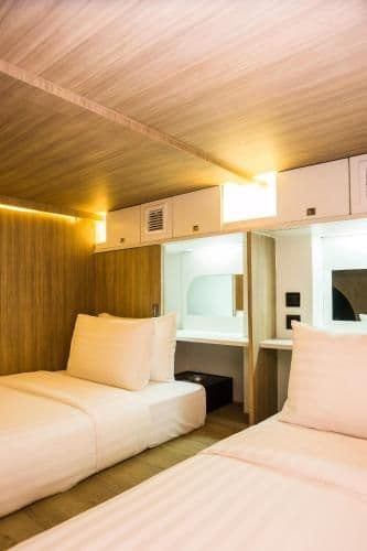 Twin Capsule Suite with Shared Bathroom