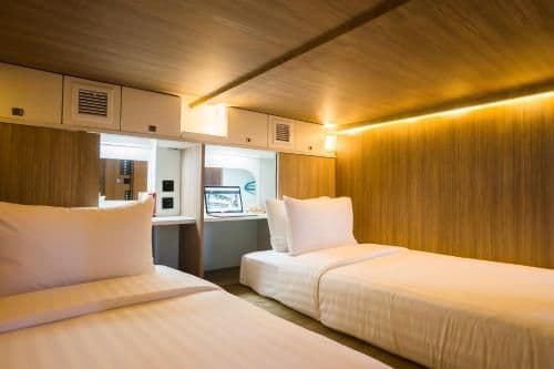 Twin Capsule Suite with Shared Bathroom