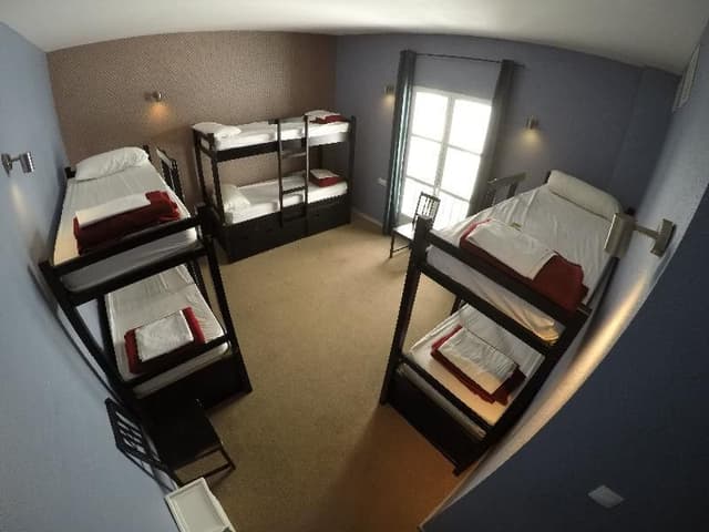 Bed in dormitory WITH SHARED BATHROOM