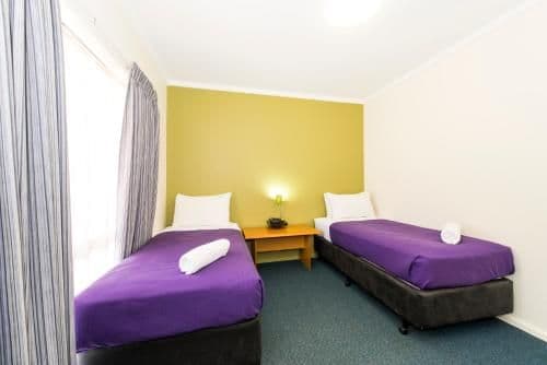 Standard Room with One Queen Bed and Two Single Beds