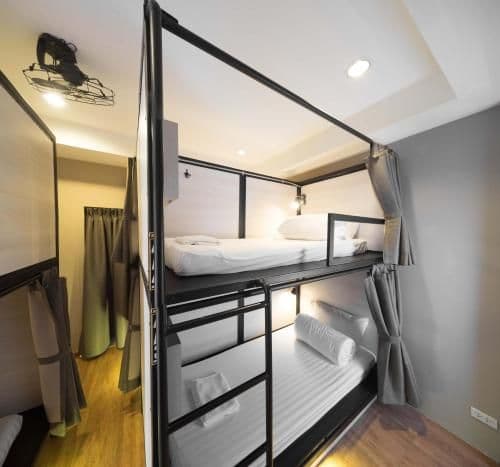Bunk bed in mixed dorm with a bath room inside