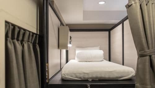 Bunk bed in mixed dorm with a bath room inside