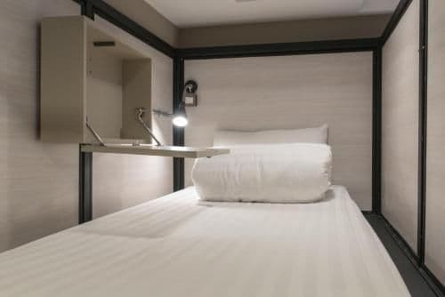 Bunk bed in mixed dorm with a bath room inside