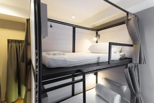Bunk bed in mixed dorm with a bath room inside