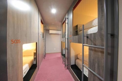 Two Bunk Beds in Male Dormitory Room