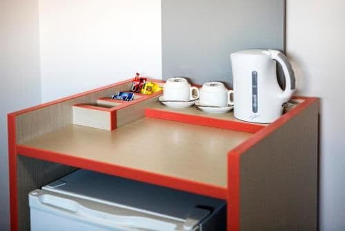 Compact King Room with Shared Bathroom and Free Welcome Drink For Two Guests