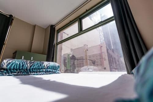 Bed in 4-Bed Female Dormitory Room with Shared Bathroom