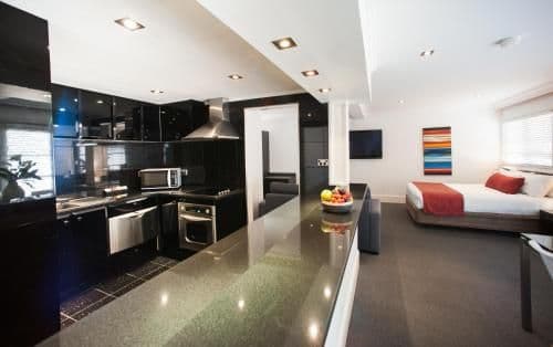 Deluxe Queen Suite with Kitchen and Pool View