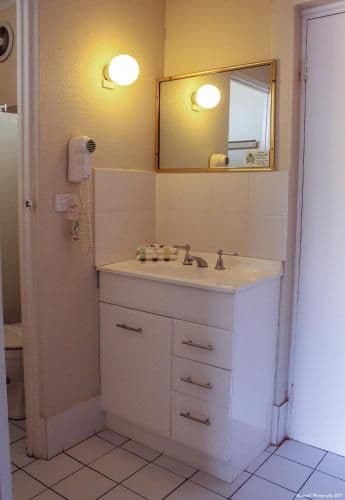 Downstairs Room with a Queen and 3 Single Beds