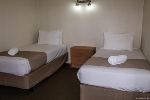 Downstairs Room with a Queen and 3 Single Beds