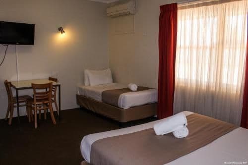Downstairs Room with a Queen and 3 Single Beds