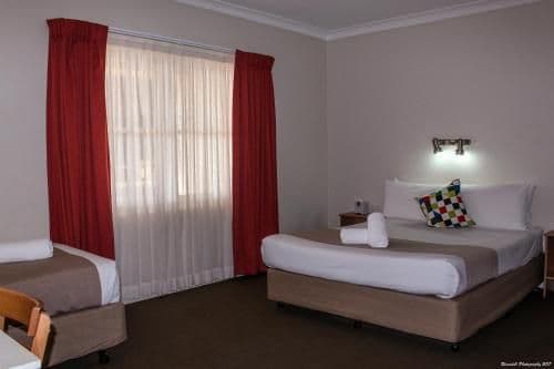 Downstairs Room with a Queen and 3 Single Beds