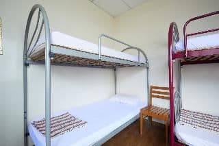 Bed in dormitory WITH SHARED BATHROOM