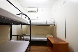 Bed in dormitory WITH SHARED BATHROOM