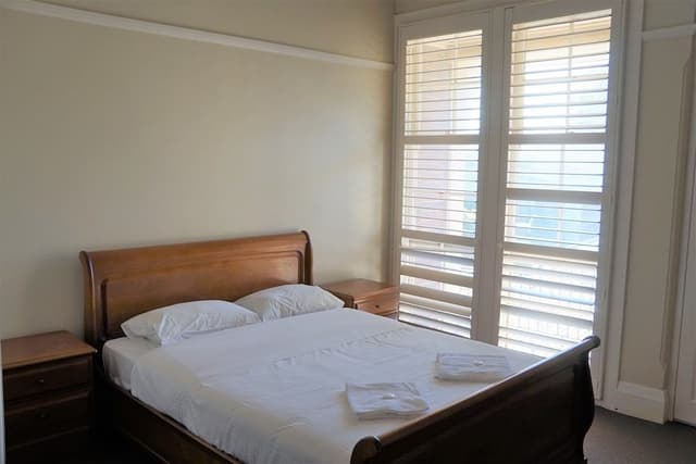 Queen Room with Shared Bathroom