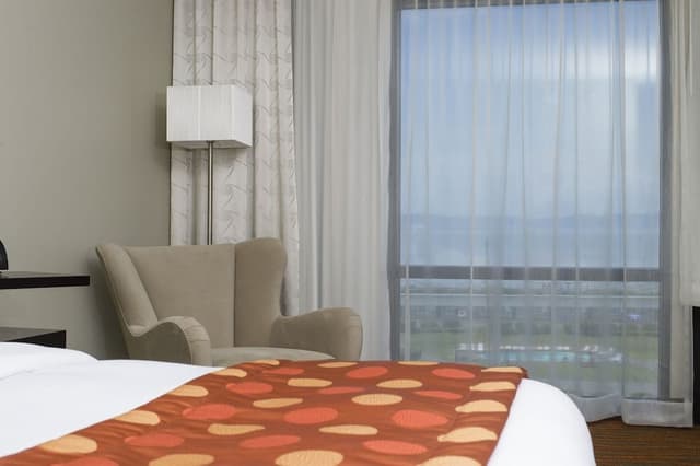 Aqua room with 1 king bed, river view