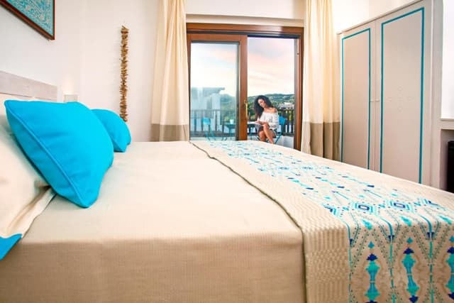Junior Suite with Balcony and Pool View