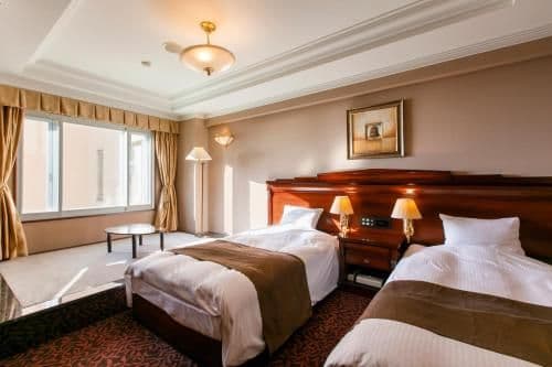 Room with Carpeted area, Open Air Bath and Partial Ocean View- Non-Smoking