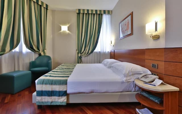 Quadruple Room with 1 King and 2 Single Beds