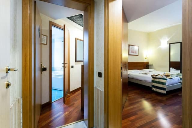 Quadruple Room with 1 King and 2 Single Beds
