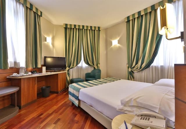 Quadruple Room with 1 King and 2 Single Beds