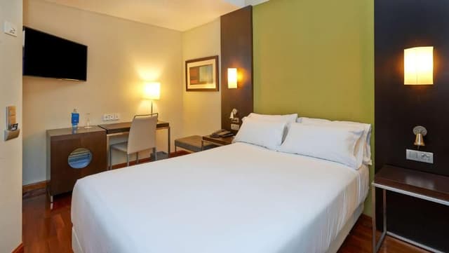 Family Adjoining Room (3 Adults + 1 Child)