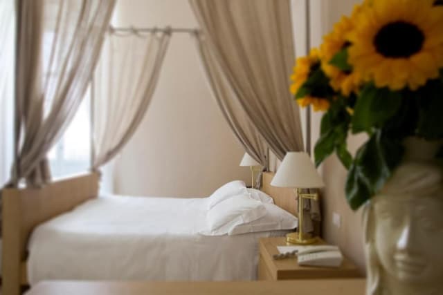Superior room with a four poster bed