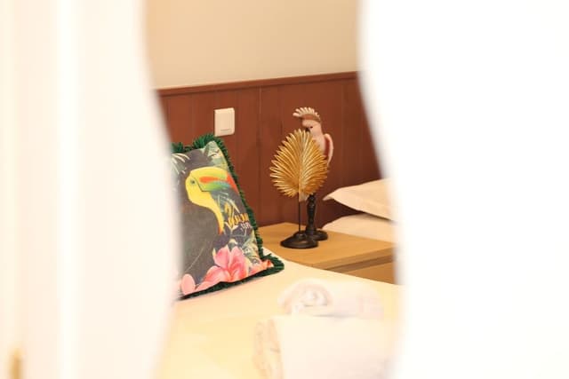 Quadruple Room (vue sur mur peint)