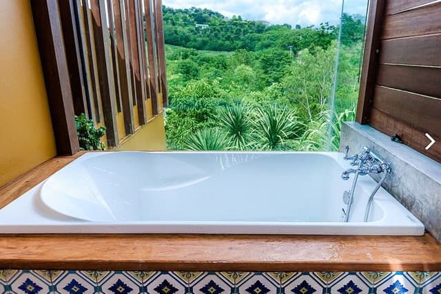 Deluxe balcony with bathtub