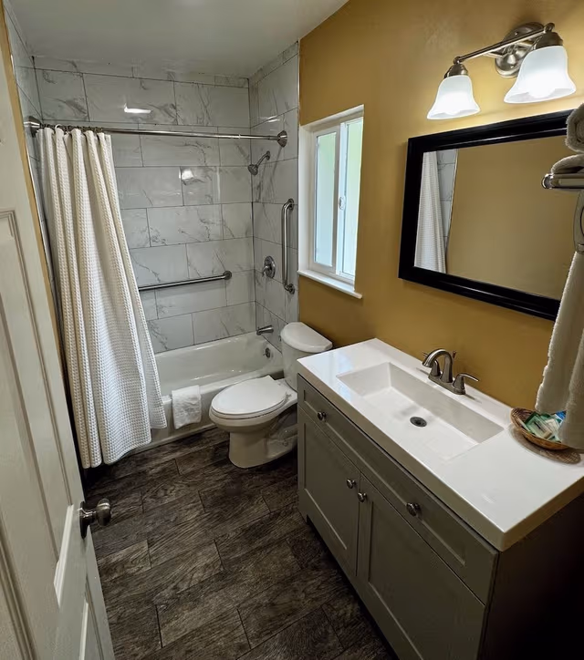 Double Queen Bedroom with Fireplace: Partial Ocean View