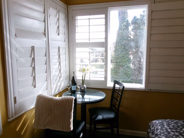 Double Queen Bedroom with Fireplace: Partial Ocean View